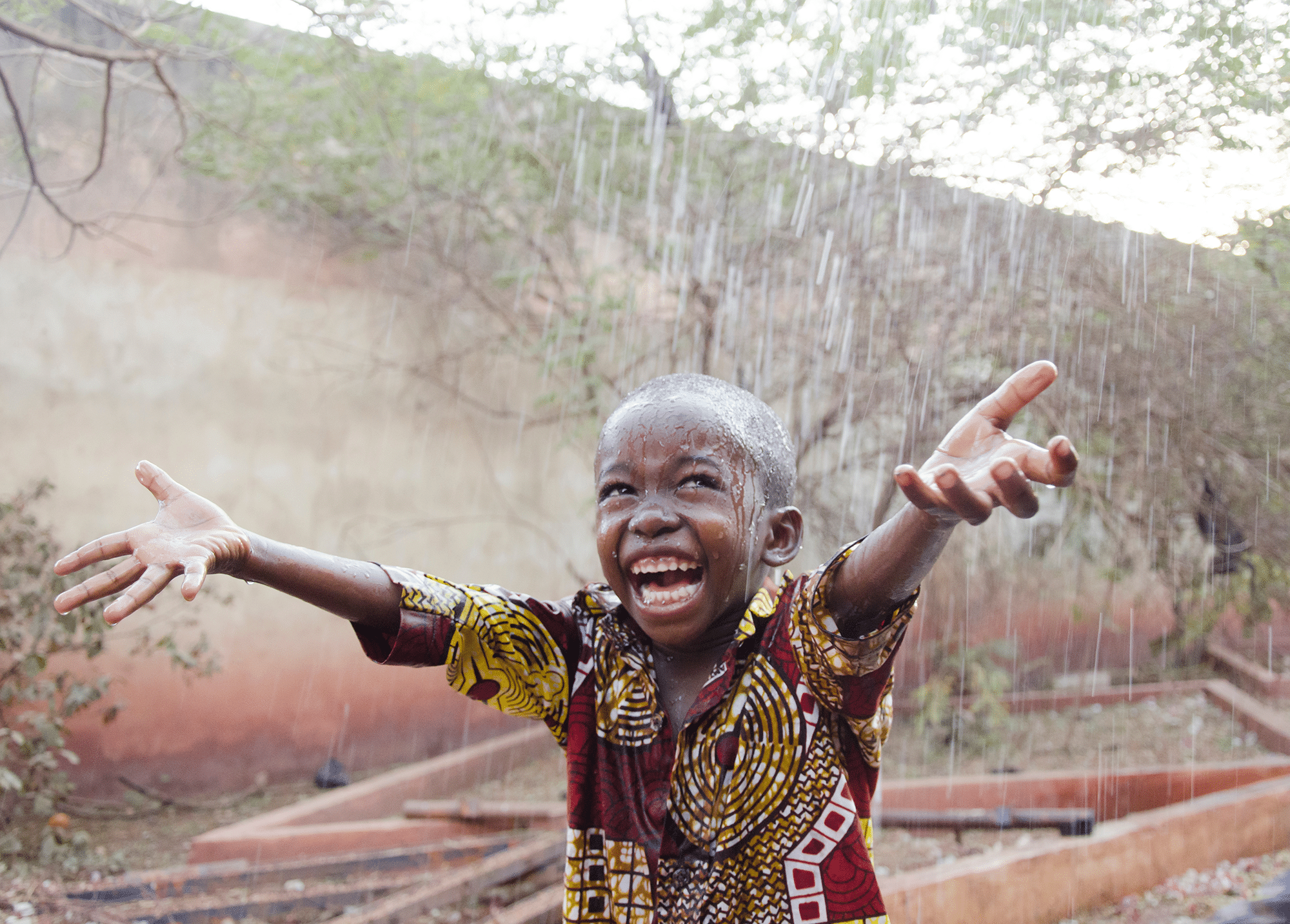 A child in Mali greeting Dr. Palmer's humanitarian dental team